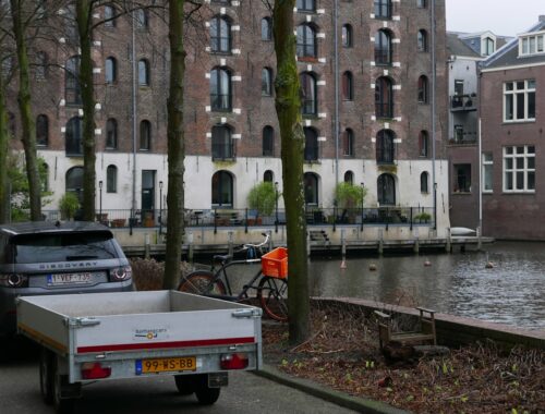 a truck parked next to a body of water